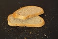 Isolate of white loaf of bread with sliced Ã¢â¬â¹Ã¢â¬â¹pieces on a black background Royalty Free Stock Photo